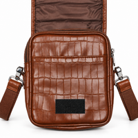 Brown crocodile-textured sling bag back detail